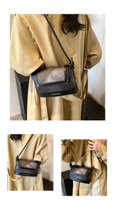 Close-up of quilted pattern and textured finish on a stylish grey crossbody bucket bag