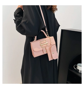 Pink lychee texture crossbody bag with gold buckle and matching coin purse on model