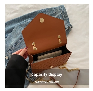 Macro view of brown quilted crossbody bag showing smartphone capacity inside