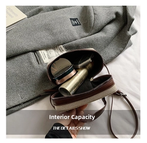 Interior view of small crossbody bag showing space for lipstick and cosmetics