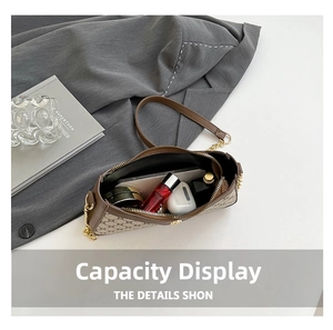Interior view showing capacity for smartphone and cosmetics in brown monogram bag