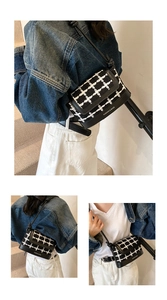 Detail of checkered crossbody bag showing PU leather texture and cross-stitch embroidery