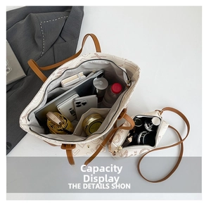 Top view of spacious tote bag interior showing capacity for laptop, phone and cosmetics