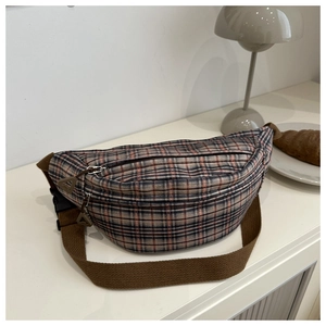 Detail of vintage plaid corduroy waist bag with dual zippers and adjustable brown strap
