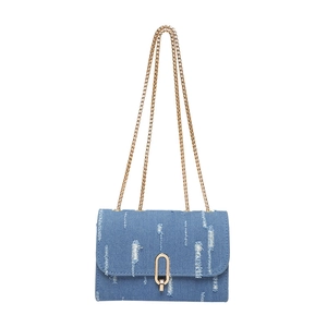 Blue distressed denim crossbody bag with gold chain strap and oval metal clasp closure