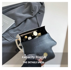 Internal view of a white leather crossbody bag showing storage capacity for daily items