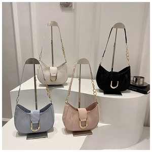 Detail of crescent shoulder bags with U-shaped metal buckle and chain strap in four colors
