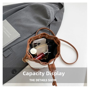 Top view of bucket bag interior showing spacious capacity for phone and cosmetics