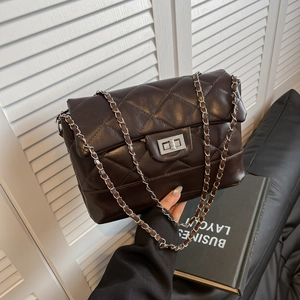 Dark brown quilted shoulder bag with silver turn-lock and metal chain strap