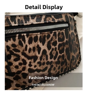 Close-up of leopard print shoulder bag featuring a silver zipper and stud embellishments