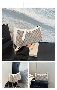 Detail of white leather patchwork underarm bag with gold flower clasp and chain strap