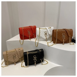 Detailed display of assorted quilted faux leather crossbody bags with golden chain straps