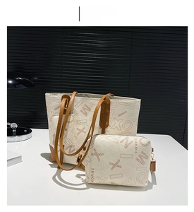 Detail view of the matching small pouch and interior of the white printed tote bag