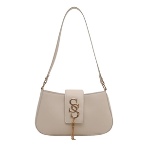 Elegant cream leather crescent bag with gold-tone hardware and tassel detail for women