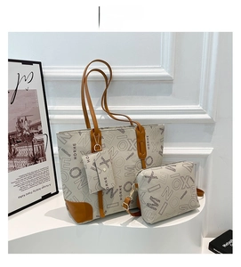 Detailed grey canvas tote set with letter print, inner pouch and mini bag accessory
