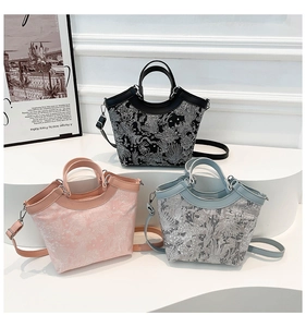 Detailed view of jacquard fabric patterns on silk shoulder bags in three elegant colors