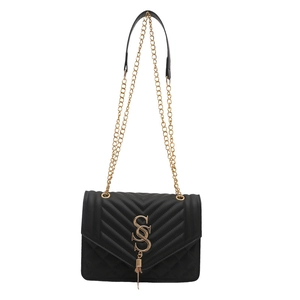 Classic black crossbody bag with V-shaped stitching and gold chain strap on white background