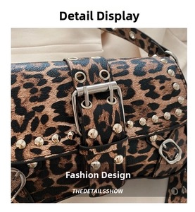 Macro detail of leopard print leather bag with silver studs and metal buckle strap
