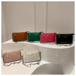 Collection of minimalist leather crossbody bags in six colors with silver chain straps