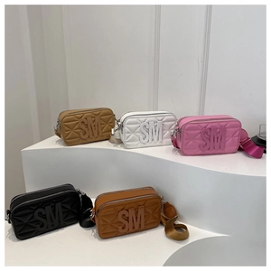Detailed display of quilted cross-body bags in five colors with textured SM logo finish