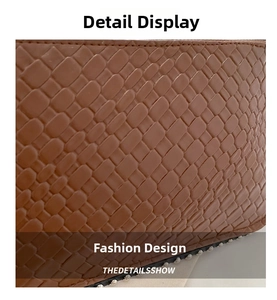 Macro detail of brown woven texture leather with metallic silver stud rivets