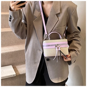 Chic beige canvas and lavender leather crossbody box bag with long tassel detail
