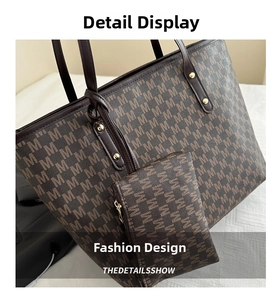 Close-up of brown letter print tote bag set with matching zipper pouch and metal rivets