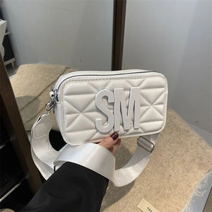 Minimalist white quilted crossbody bag with SM logo and wide fabric shoulder strap