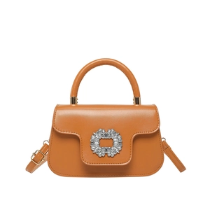 Elegant brown leather tote bag with large crystal round buckle and round top handle