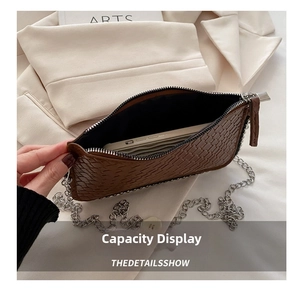 Interior view showing the large capacity of the brown woven leather shoulder bag