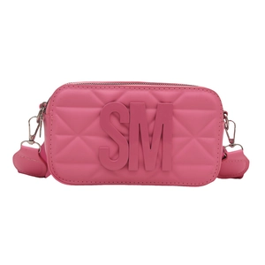 Pink quilted crossbody camera bag featuring 3D letter logo and silver hardware detail