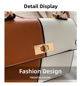 Détail du sac à main en cuir PU bicolore montrant le fermoir doré et les coutures