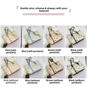 Detail view of cartoon graffiti PU tote bag in pink blue brown and black with rabbit charms