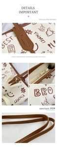 Detail of cute graffiti tote bag with gold zipper, brown strap, and plush bunny charm