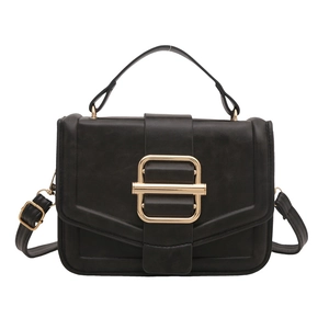 Minimalist black PU leather crossbody bag with a large gold buckle and top handle