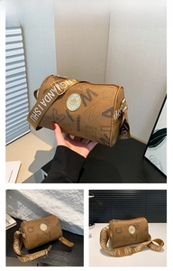 Detailed view of brown cylinder crossbody bag with leopard print and wide canvas strap