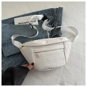 Detail of white woven texture fanny pack with golden metal zipper and nylon strap