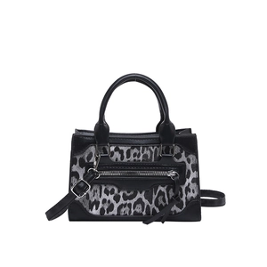 Chic black and leopard print crossbody bag with silver zippers and structured top handles