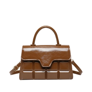 Brown chocolate-patterned tote bag with top handle and adjustable shoulder strap