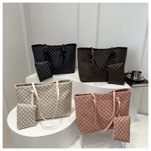 Detailed view of four sets of 'M' letter print tote bags with matching zipper pouches