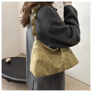 Detail of olive green marble print handbag with pleated scrunchie shoulder strap