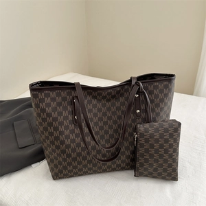 Brown monogrammed tote bag with matching pouch and dark brown leather handles