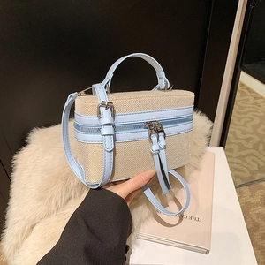 Retro color-block box bag with beige woven body and light blue leather trim detail