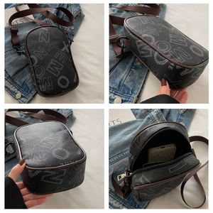 Detailed views of a trendy black letter crossbody bag with durable nylon shoulder strap