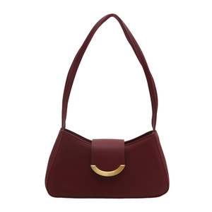 Vintage burgundy shoulder bag with elegant golden crescent buckle on matte leather