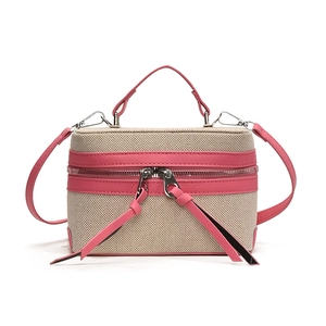 Beige canvas box crossbody bag with rose pink leather trim and dual zip closure