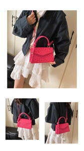 Three-way view of pink floral embossed handbag showing handheld and crossbody styles