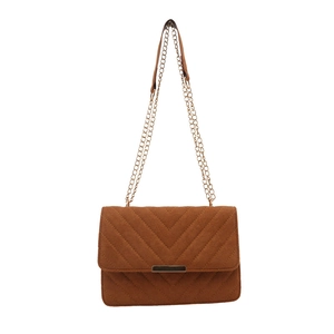 Brown faux suede crossbody bag with chevron stitching and gold chain strap on white background