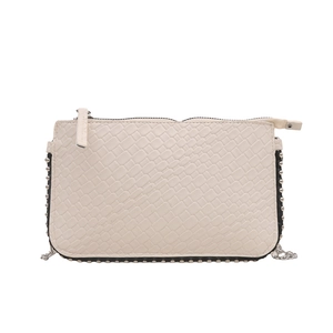 White snakeskin embossed envelope crossbody bag with silver rivets and metal chain strap