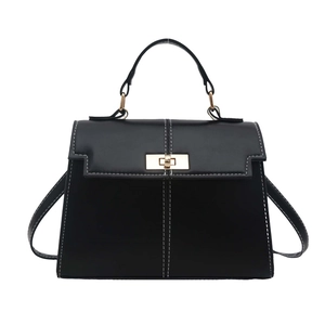Chic black trapezoid handbag with white contrast stitching and gold metal turn-lock closure